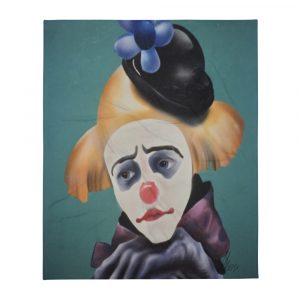 Airbrushed clown with yellow hair and black hat with flower on a throw blanket