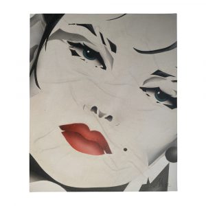 airbrushed girls face with blue eyes and red lips on a throw blanket