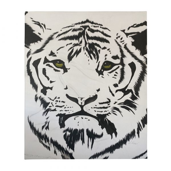 White tiger face with green eyes painted on throw blanket