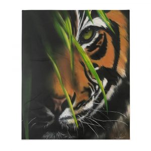 Airbrushed Bengal Tiger with green eyes peeking through green blades of grass on a decorative Throw