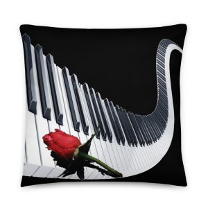 Black and white piano keys with a red rose on top painted on decorative pillow 22x22