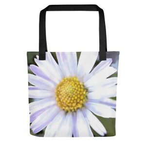 white daisy with yellow center on a tote bag