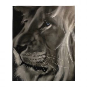 Black and white airbrushed lion head side view green eye on throw blanket